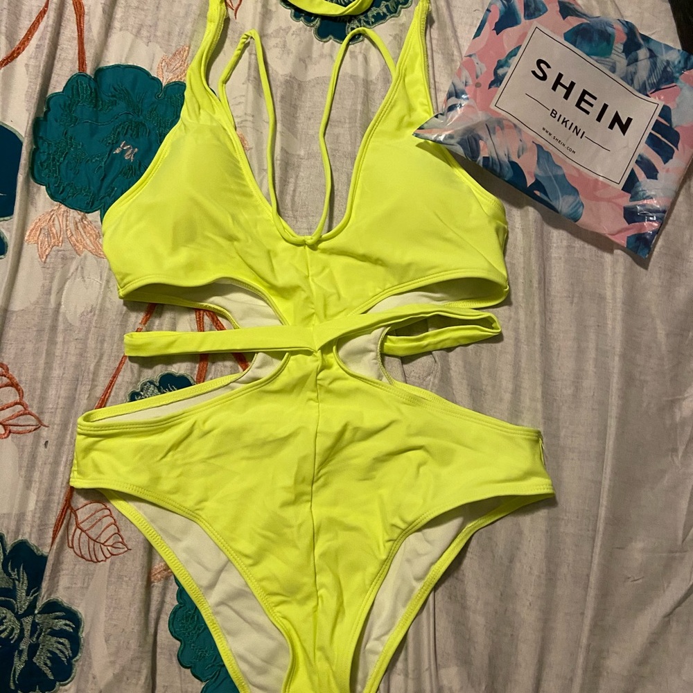One piece swimsuit neon green/yellow. Never worn.